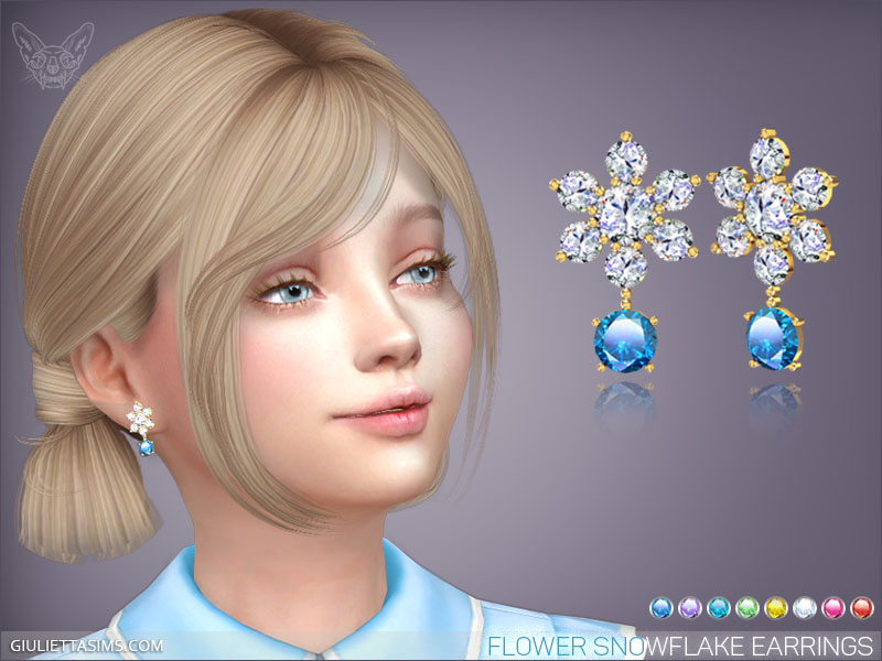 Una niña Sims de cabello rubio y ojos azules que lleva puesto un par de aretes de copo de nieve.