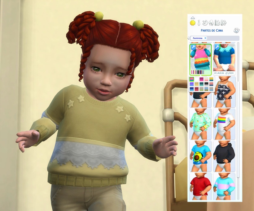 Un bebé pelirrojo de los Sims 4 que lleva puesto un suéter amarillo con encaje.