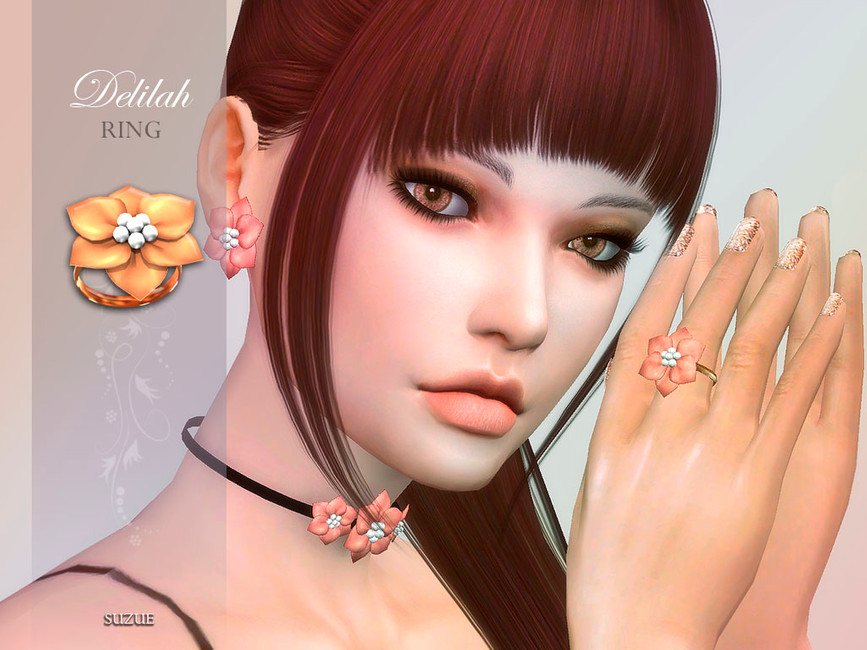 Un sim con cabello rojo oscuro y ojos marrones. Lleva puesto un conjunto de joyas a juego de Sims 4 CC que incluye pendientes, un collar y un anillo.