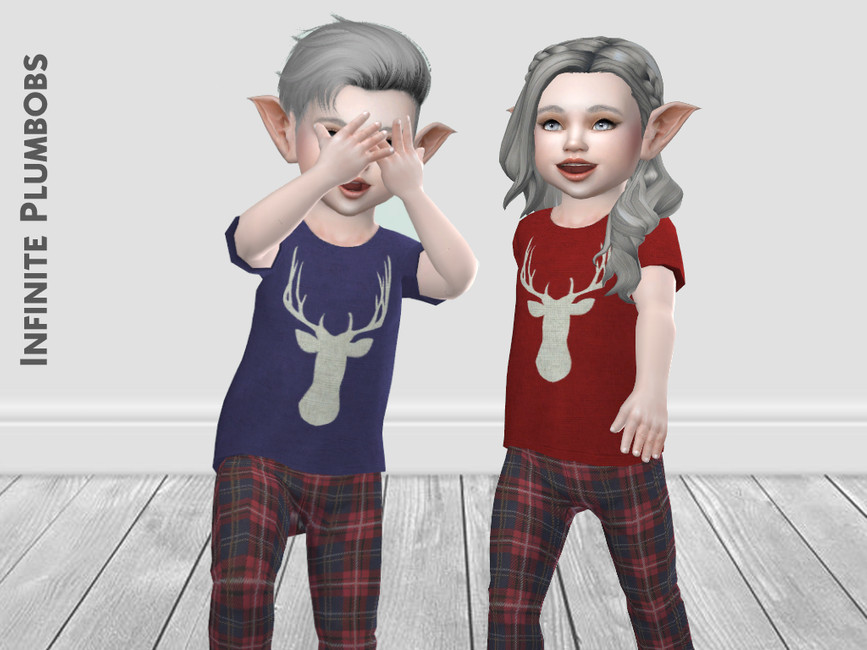 Dos niños pequeños con cabello gris y orejas de elfo usando pijamas con un ciervo en ellas